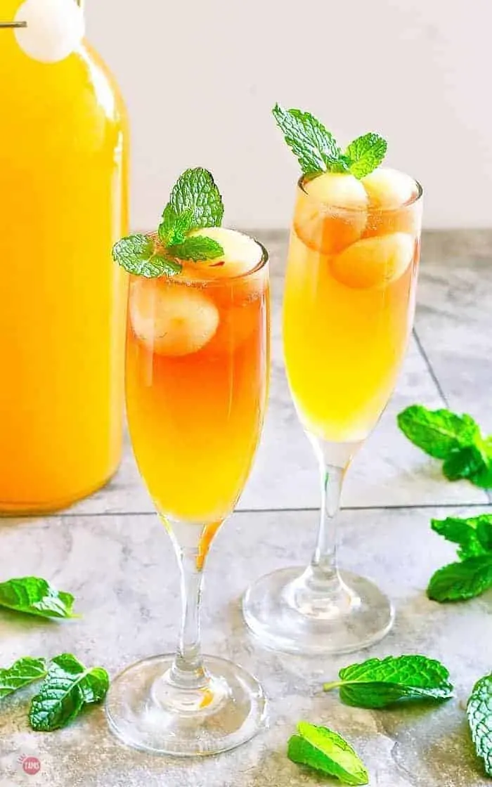 side angle of cider mimosa in champagne flute