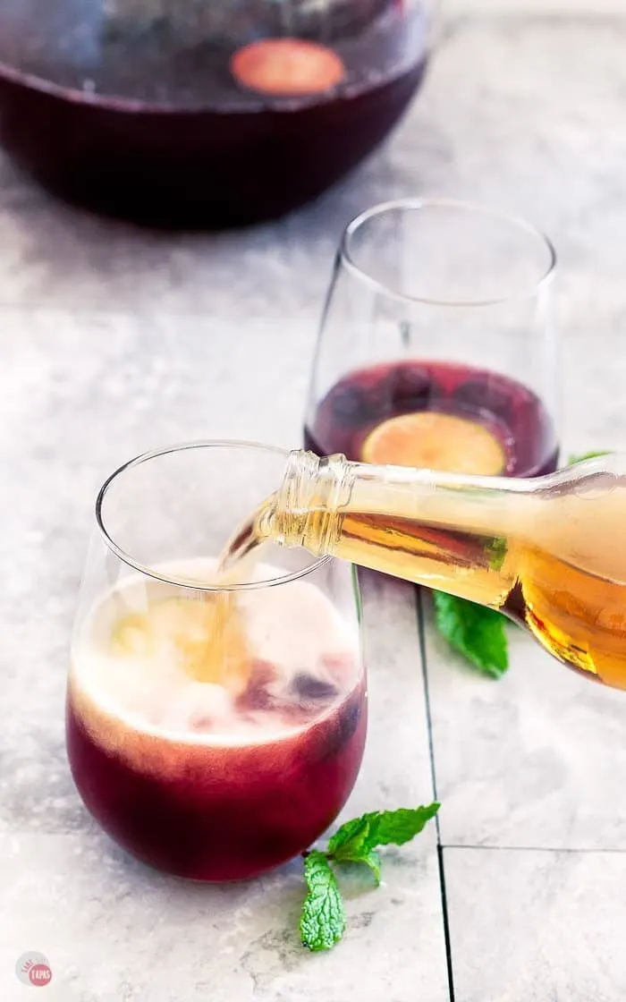 pouring cream soda in glass with cherry punch