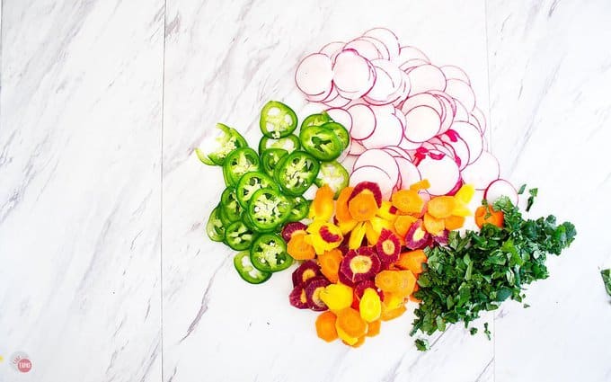 slice the carrots, jalapeños, and radishes thin when making quick taco pickles