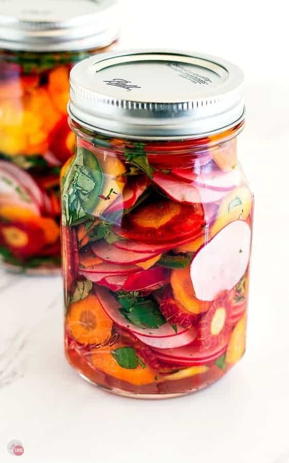 a jar of brightly colored taco pickles