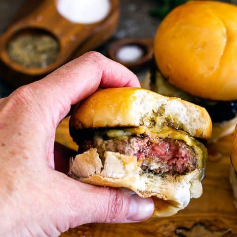 hand holding slider with bite out of it