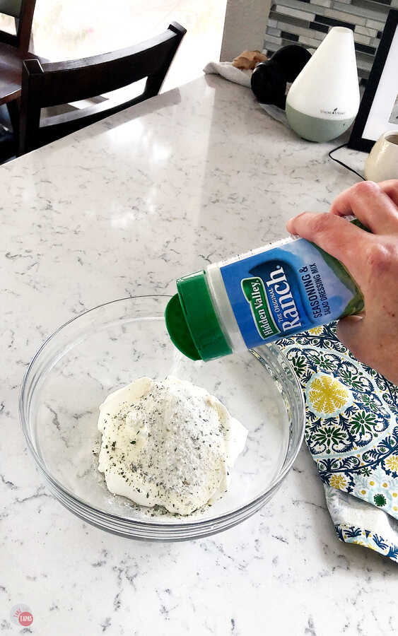 A quick shake of the seasoning shaker and you have some delicious ranch seasoning that makes this spinach dip so delicious! #easy #cold #recipe #fresh #appetizers #holidays #sourcream #HVRlove #Ad @hvranch