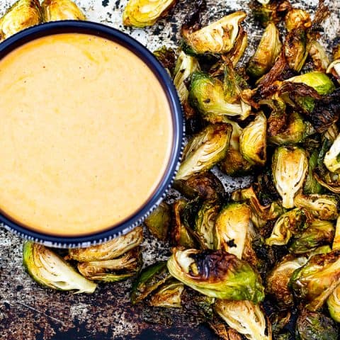picture of air fryer Brussels sprout in buffalo ranch dip