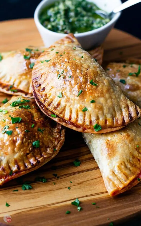 close up of empanadas on a serving board