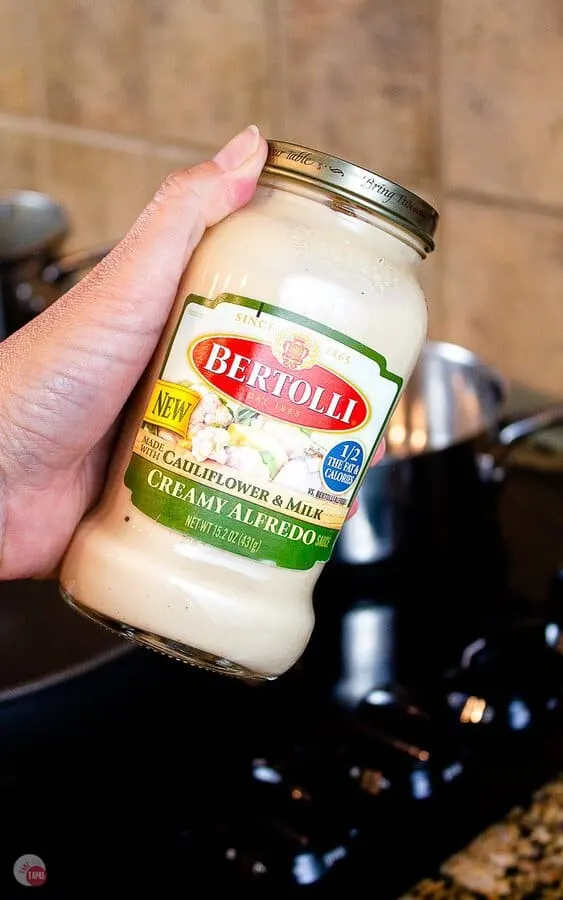 jar of New Bertolli Creamy Alfredo Sauce with Cauliflower & Milk