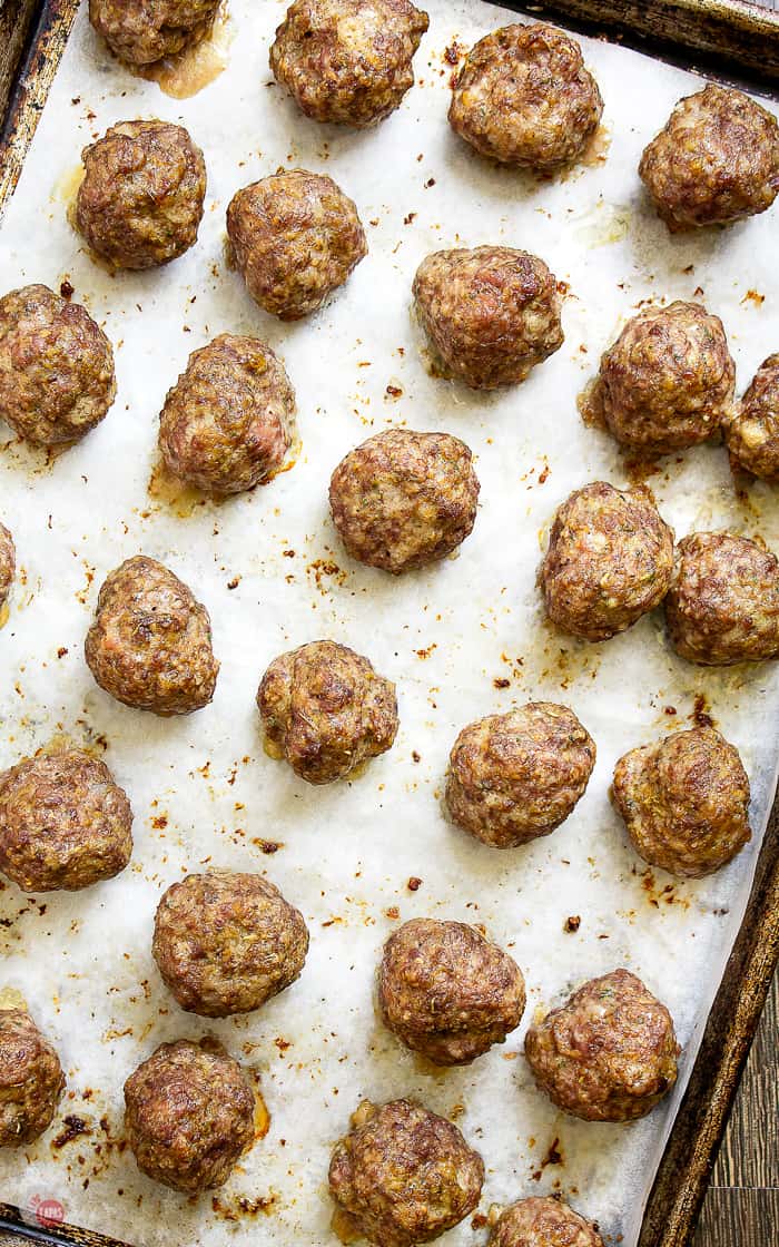 cooked meatballs on a baking sheet