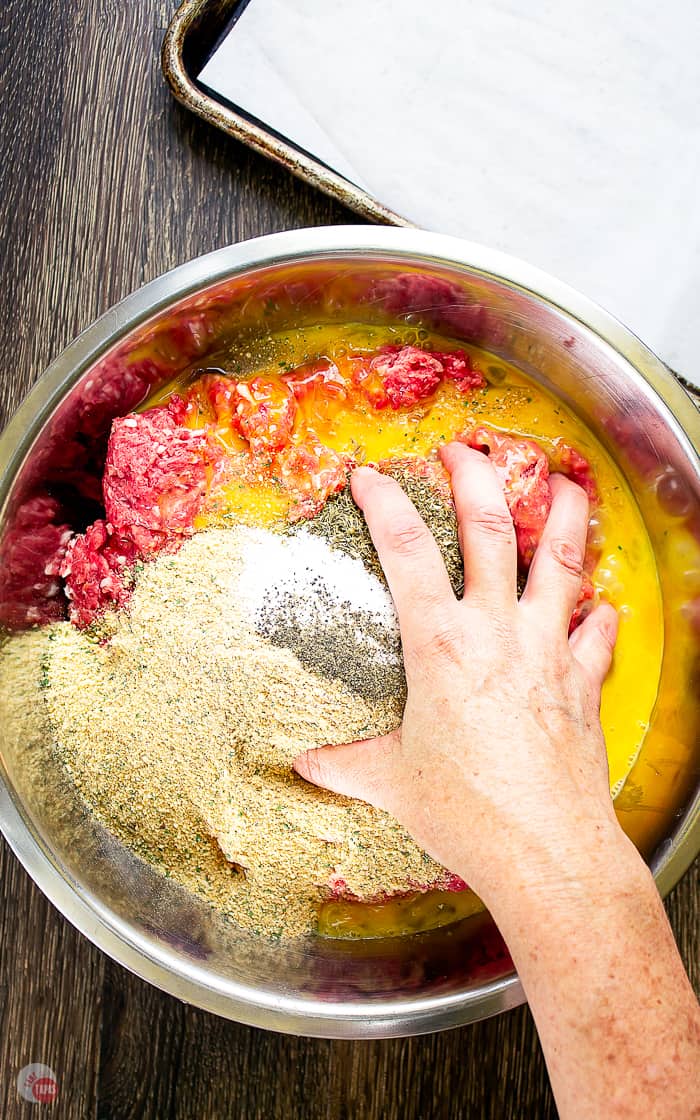 hand mixing meatball mixture
