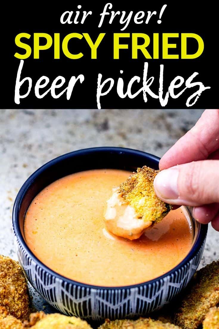 Pinterest image of hand dipping fried pickle in sauce with text "air fryer! spicy fried beer pickles"