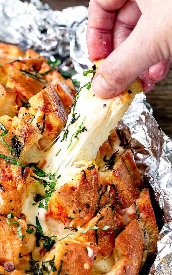 pulling a piece of pull apart bread