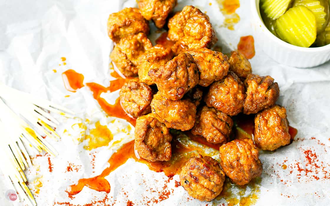 spicy chicken meatballs on a piece of white parchment