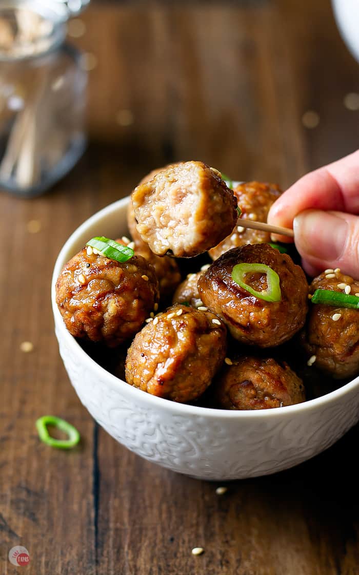 close up of meatball with a bite taken