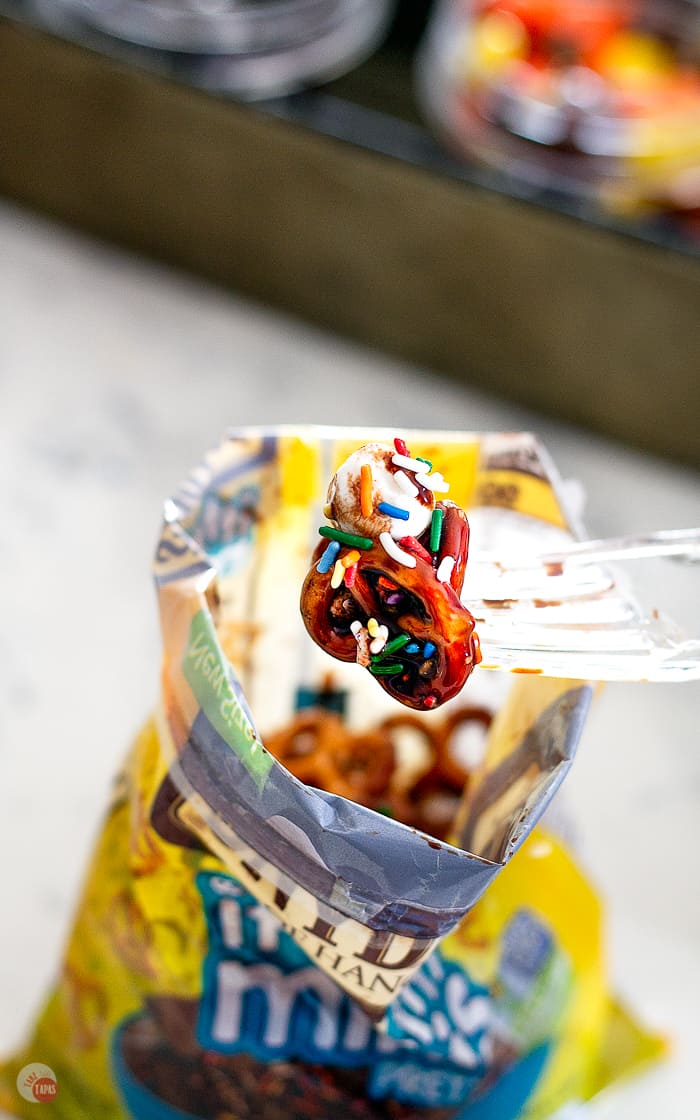 close up of pretzels with chocolate sauce and sprinkles