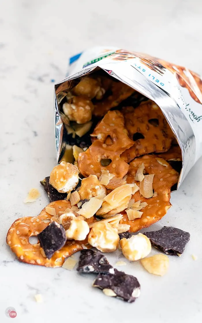 picture of snack mix spilling out of bar onto a table