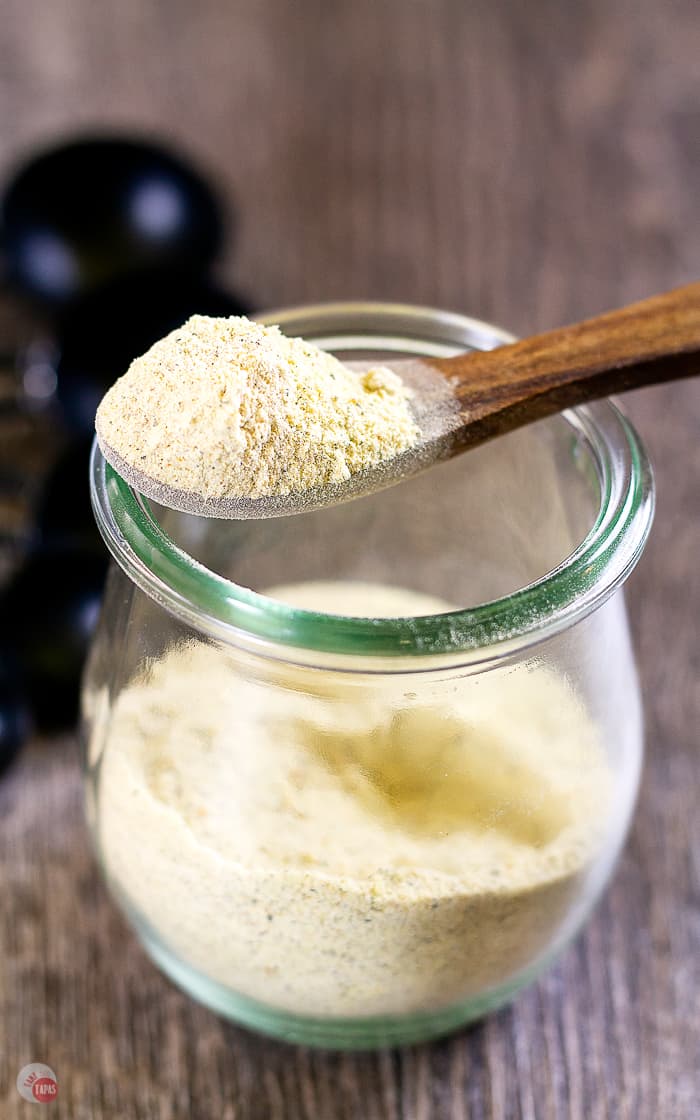 spoon of spice mix on top of a jar