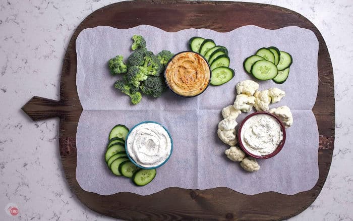 serving board with a few crudites and dips