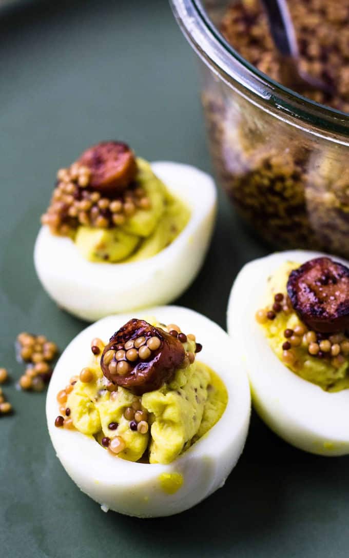 close up of mustard seeds on eggs