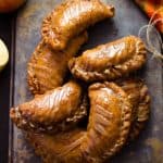 Maple Brown Butter Glazed Amish Apple Fry Pies on dark serving platter