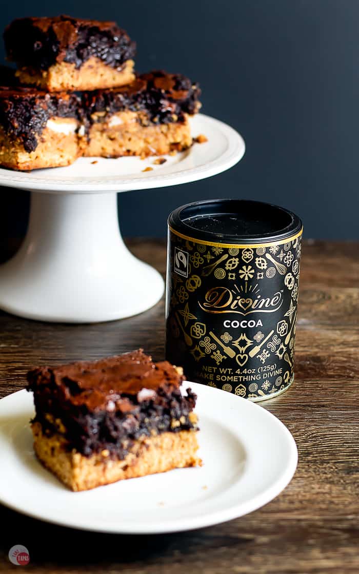 side view of can of cocoa next to peanut butter oreo brownie