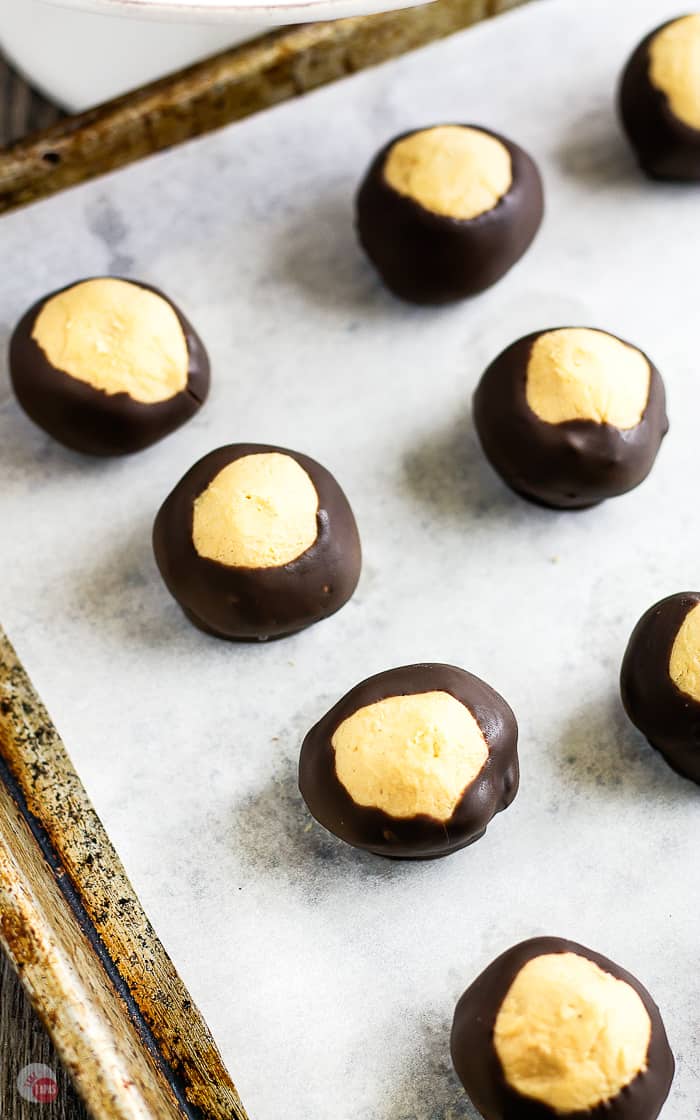 cookie sheet with peanut butter buckeyes on it