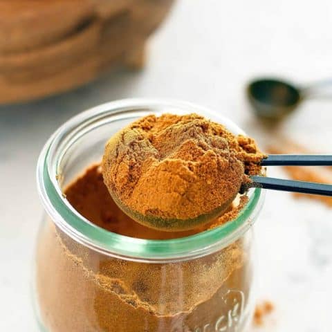 side view of a spoon full of pie spice