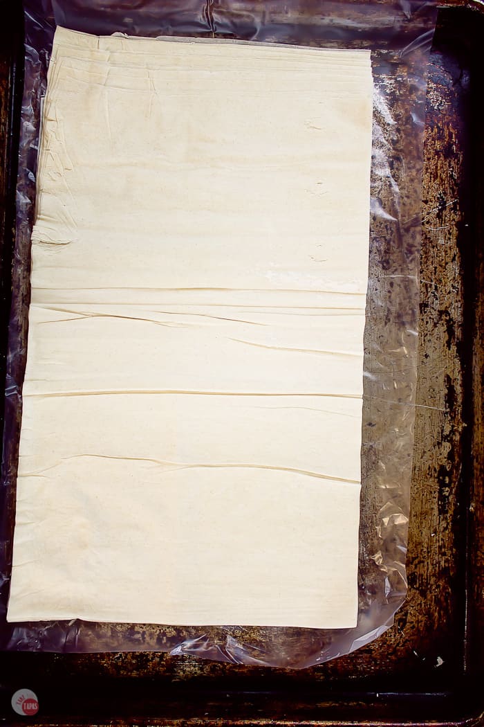 stack of phyllo sheets on a baking pan