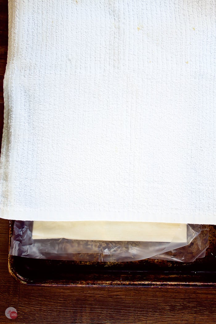 sheets of filo dough with a damp cloth over them