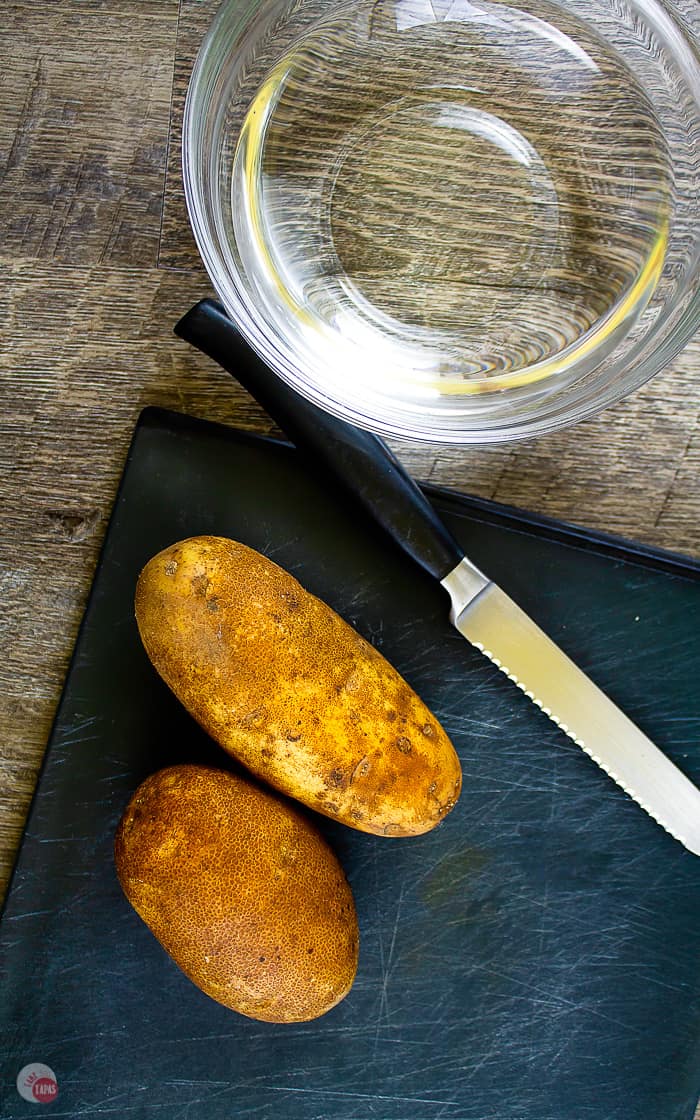 smaller baking potatoes on a cutting board