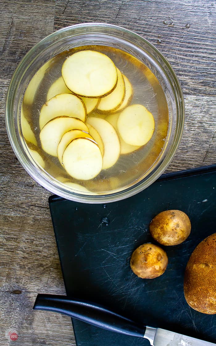 potato slices soaking in water