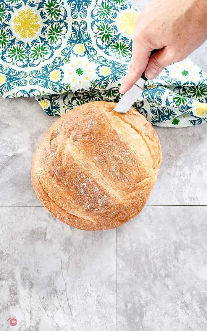 knife cutting into bread loaf