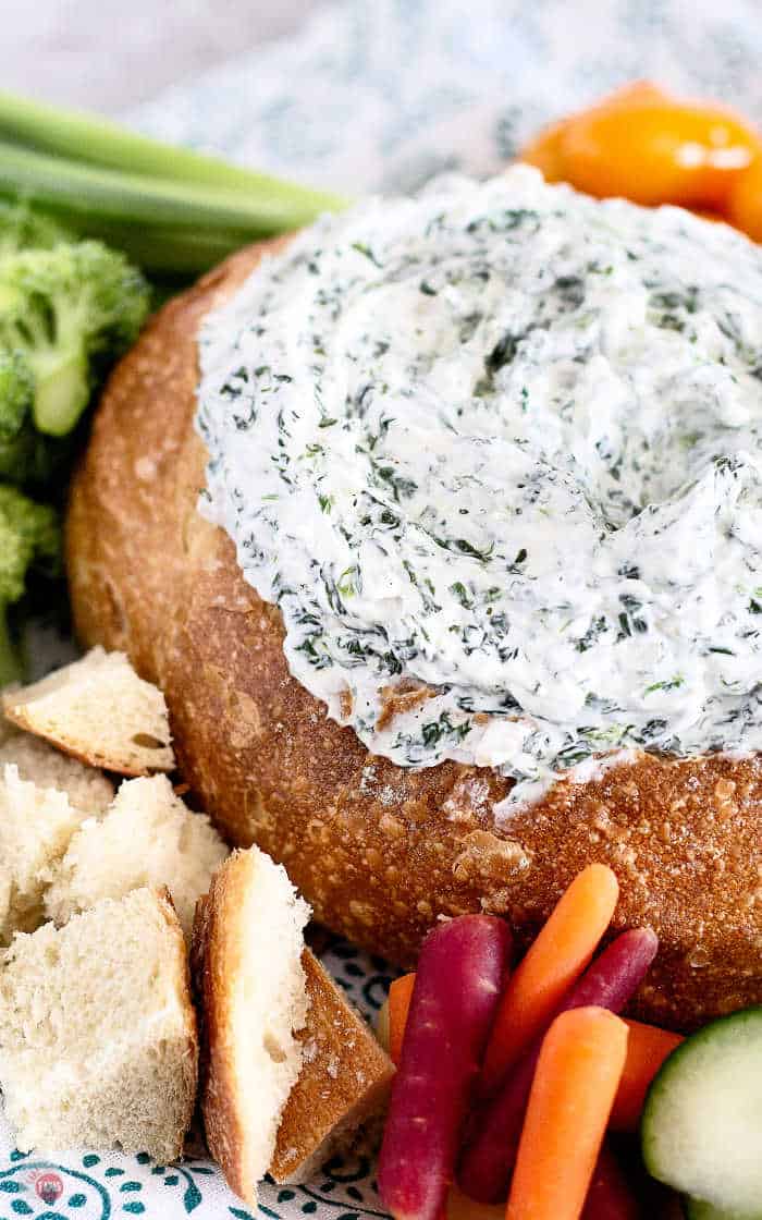 close up of spinach dip in a bread bowl