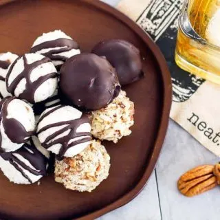 overhead shot of bourbon balls on a wood serving dish