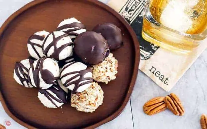 overhead shot of bourbon balls on a wood serving dish