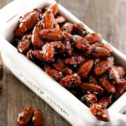 glazed seasoned almonds in a while dish