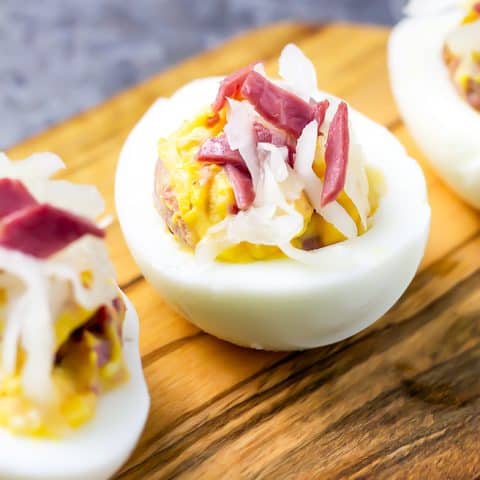 close up of Reuben Deviled egg on wood platter