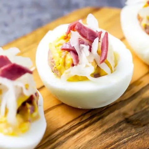 close up of Reuben Deviled egg on wood platter