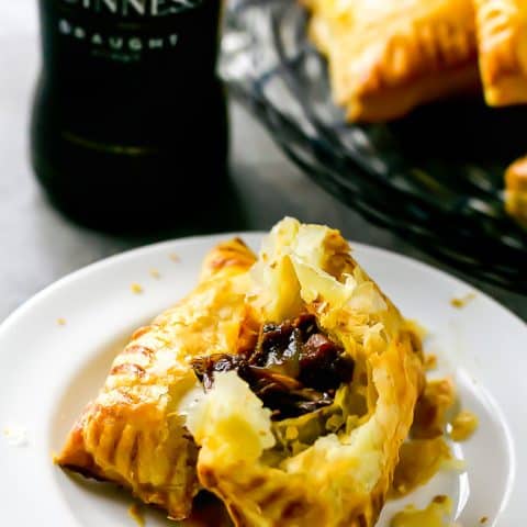 plate with savory hand pie torn in half