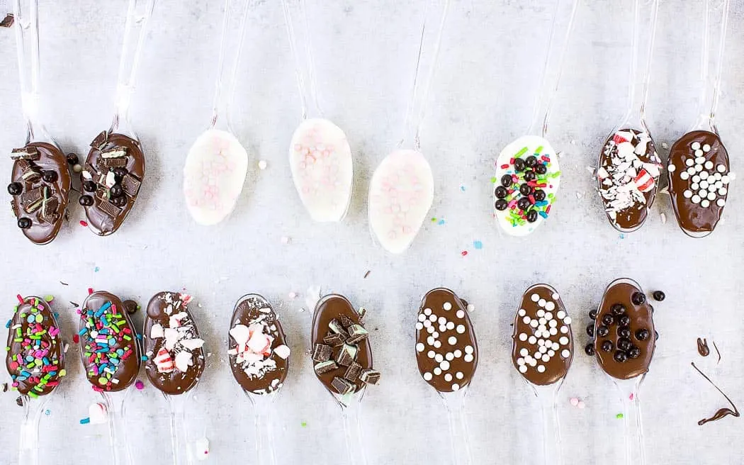 chocolate dipped spoons with toppings