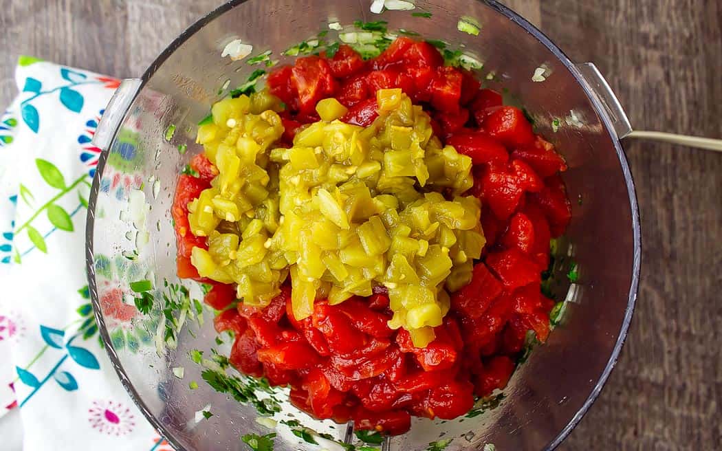 green chilies and tomatoes in a bowl