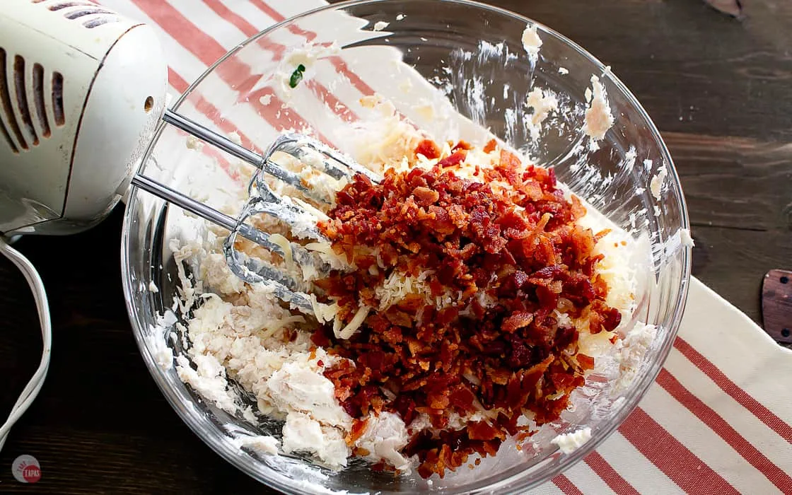 bacon on top of ingredients in a bowl