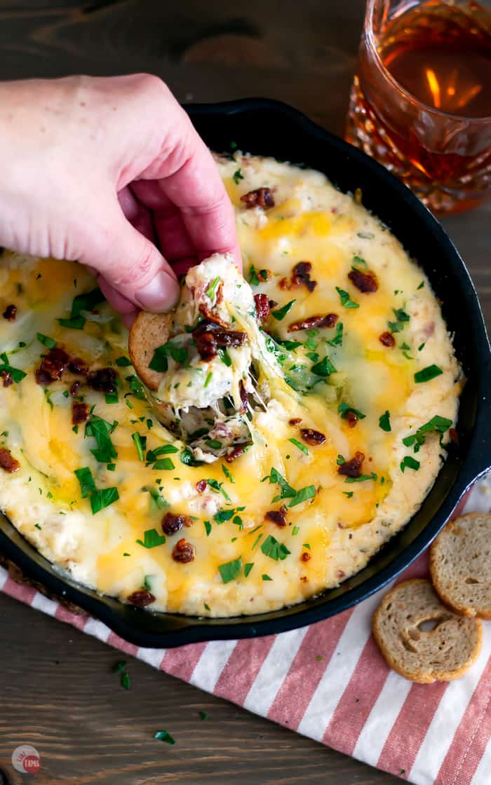 overhead picture of cracker dipping in a skillet