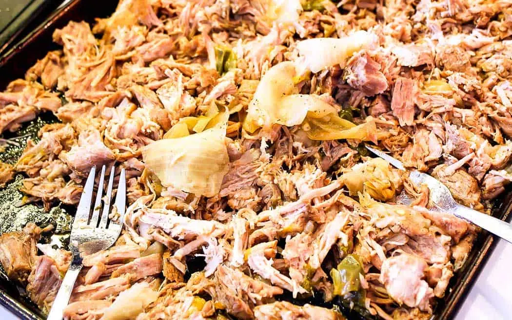 shredded pork on a baking sheet