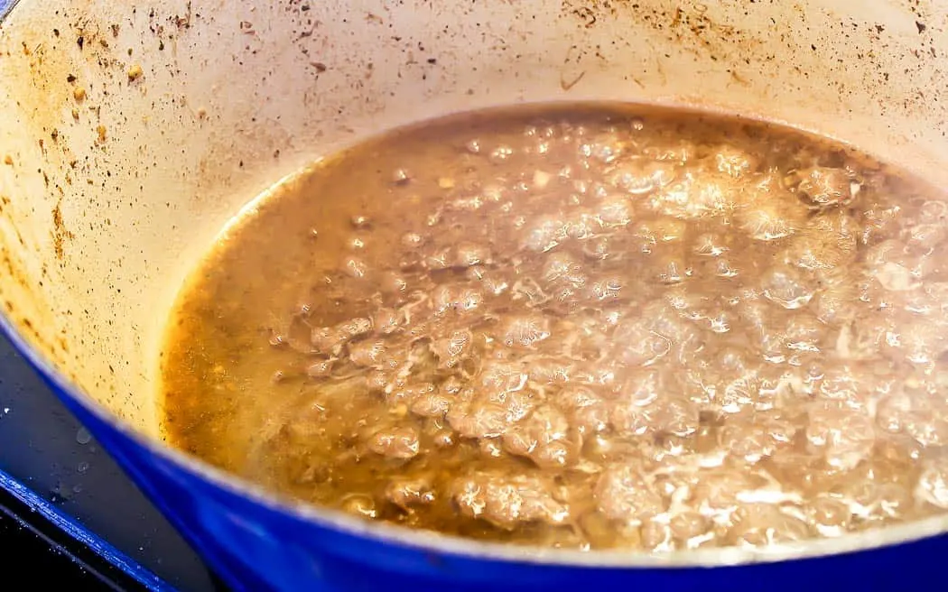 broth reducing in a stock pot