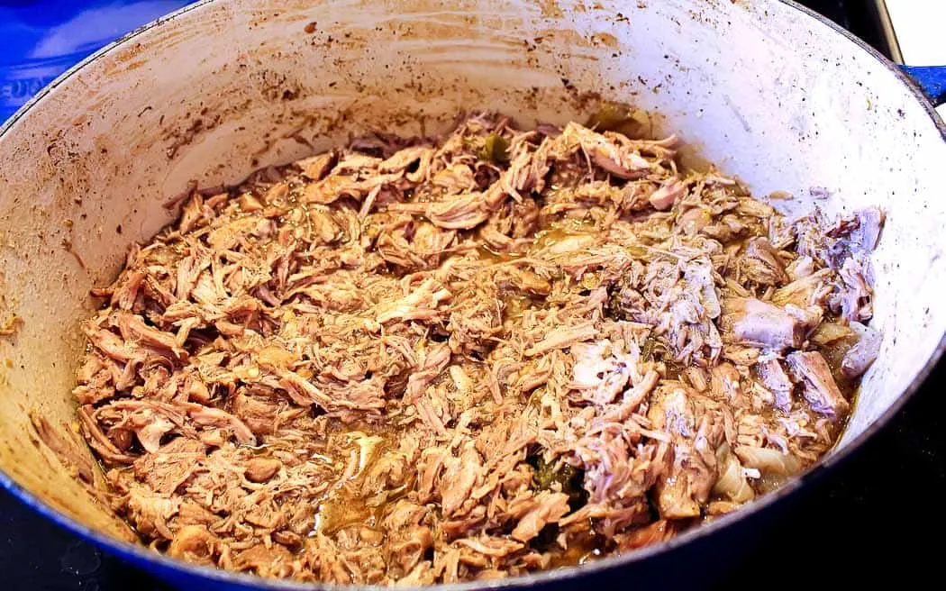 shredded pork and sauce in a blue pot