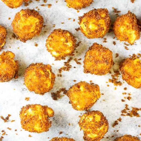 baking sheet with fried mac and cheese balls on it