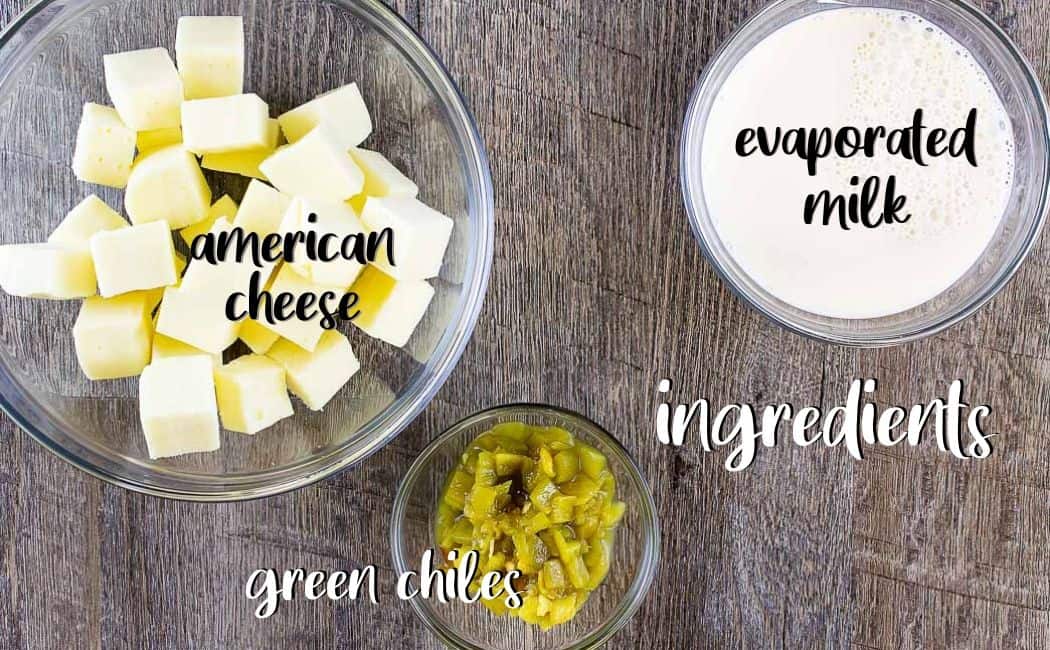 ingredients for white cheese dip on a wood board