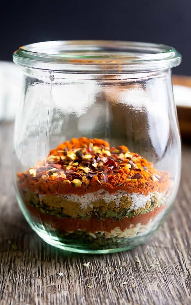 clear jar with layers of spices for southwest seasoning