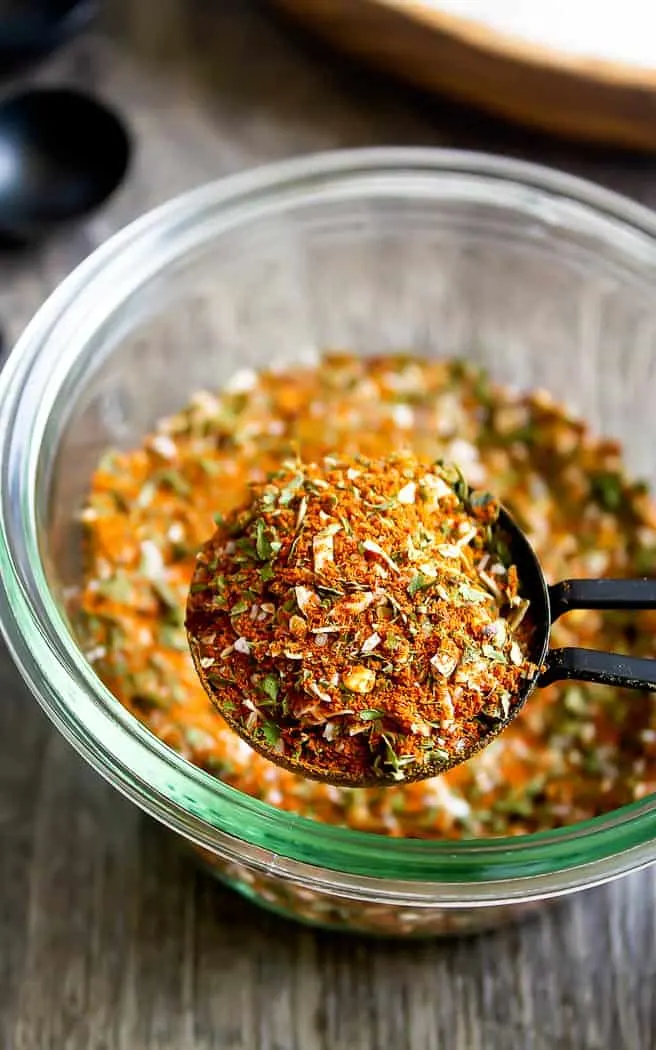 southwest seasoning in a glass bowl with a measuring spoon