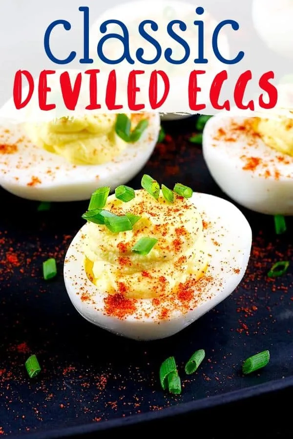 pinterest image of a single deviled egg with text "classic deviled eggs"