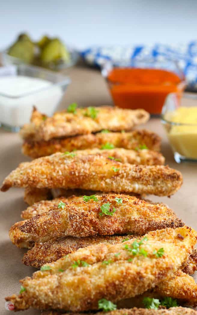 stack of air fried chicken on brown paper