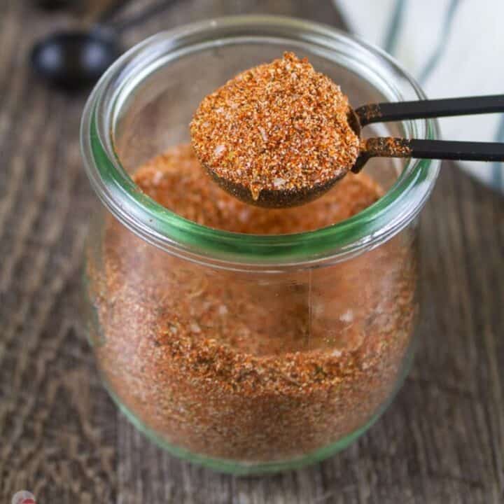 square picture of cajun seasoning in a jar